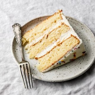 slice of vanilla cake with vanilla buttercream