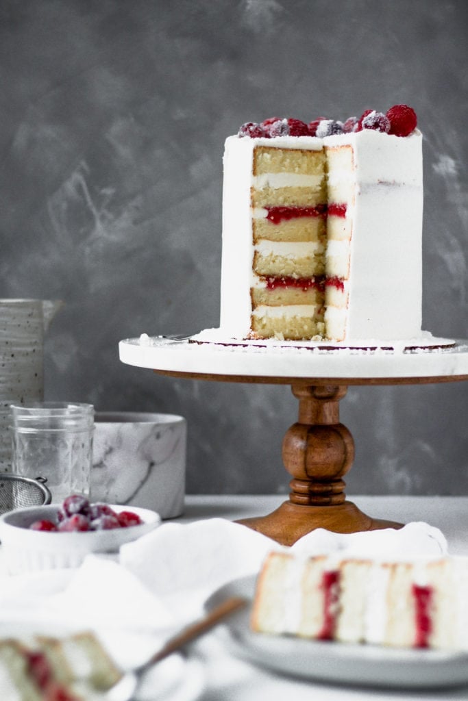 slice of cake with whole cake in background