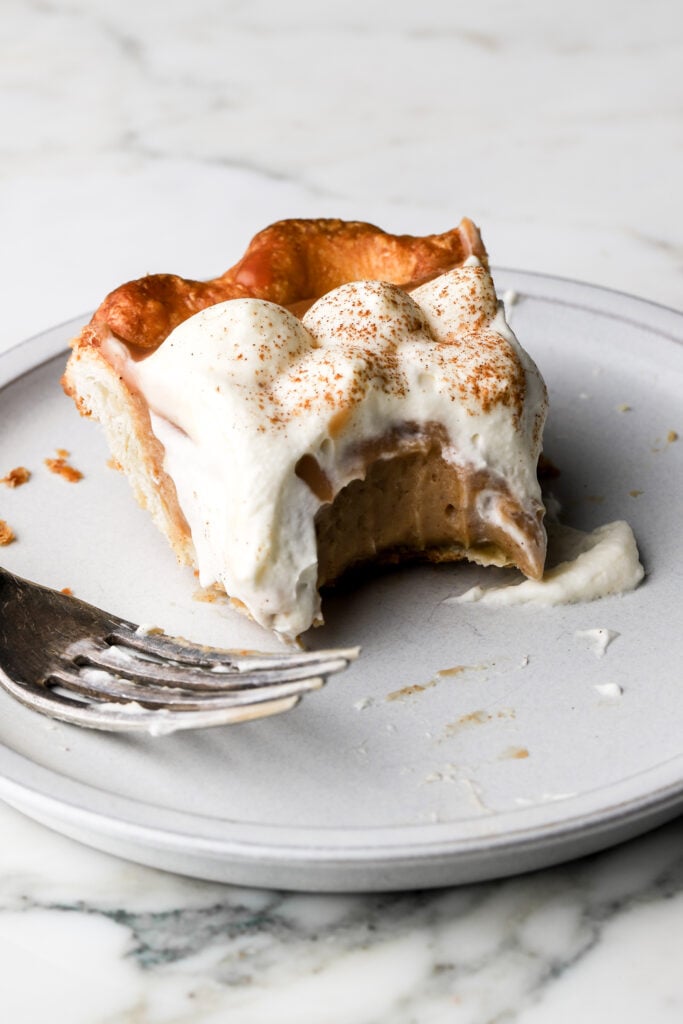 slice of apple cream pie on a plate