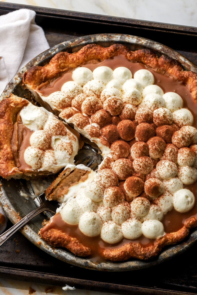 apple cream pie with slice cut out