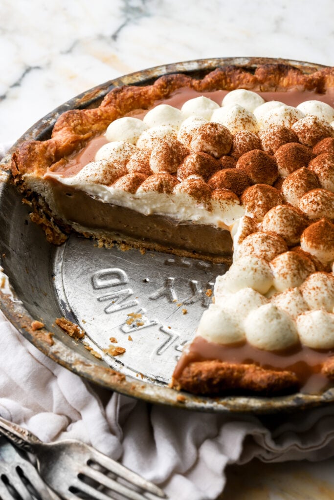 apple cream pie with slice cut pout