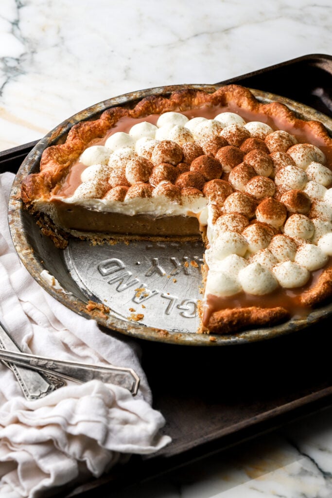 apple cream pie with slice taken out
