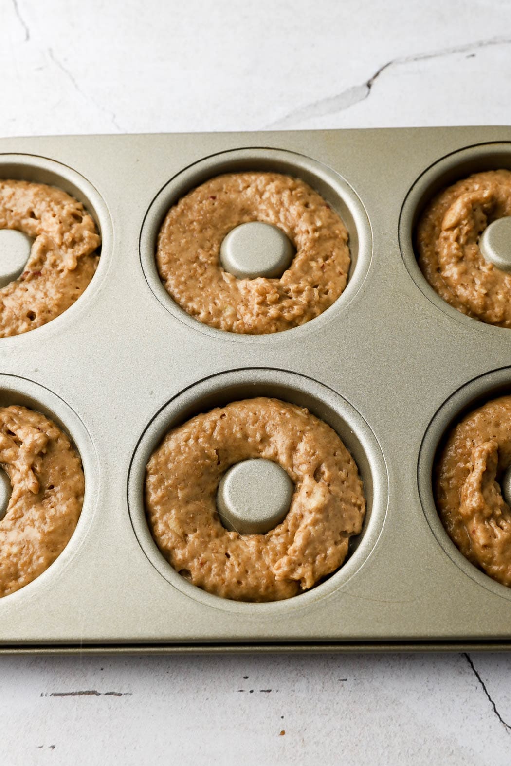 pipe batter into donuts molds