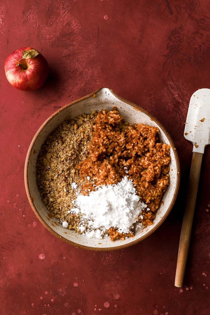add it with the nuts and a touch more powdered sugar