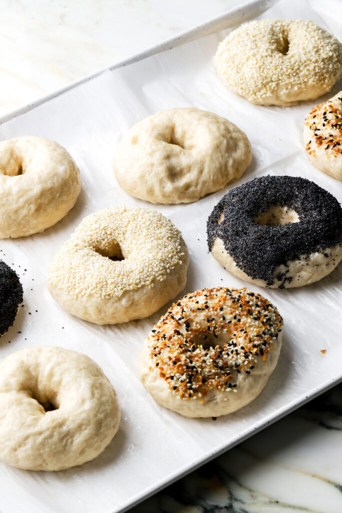 boiled bagels covered in seeds
