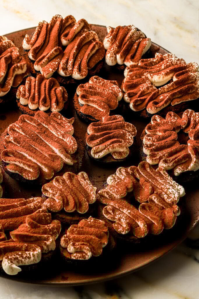 chocolate tiramisu donuts dusted with cocoa powder