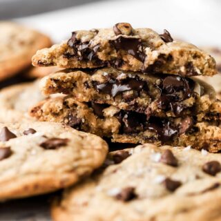 bakery style chocolate chip cookies side shot with melted chocolate