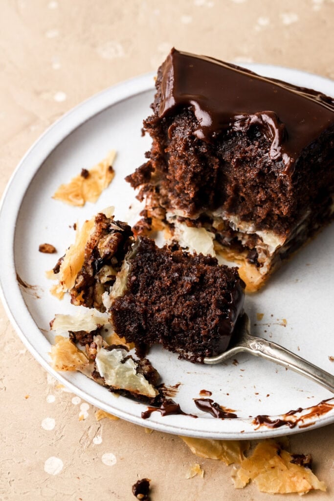 slice of baklava cake on a plate with a fork 