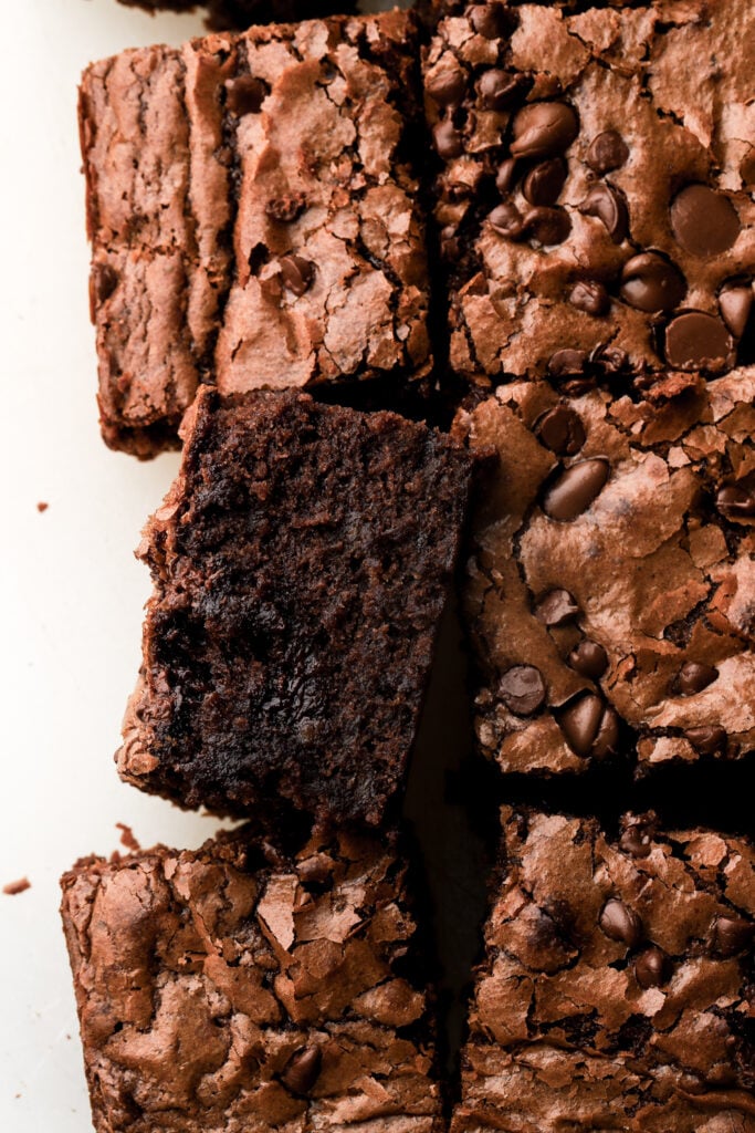brownies topped with chocolate chips and sliced 