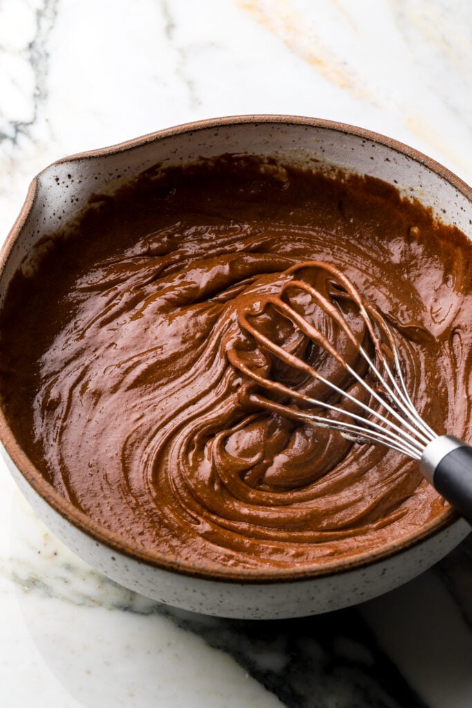 melted chocolate added to eggs and sugar