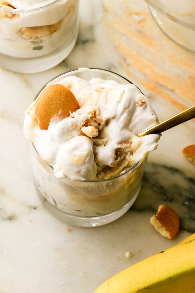 close up of banana pudding scoop in a cup