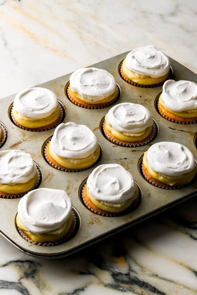 Whipped cream piped on top of banana slices
