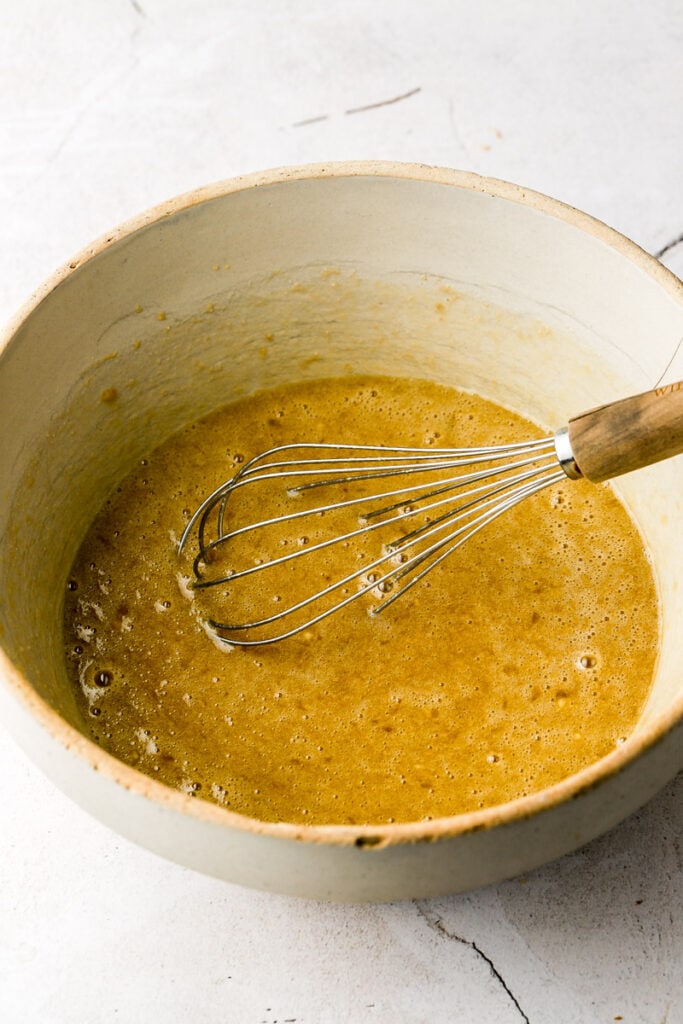 bowl with mashed bananas and sugar and oil