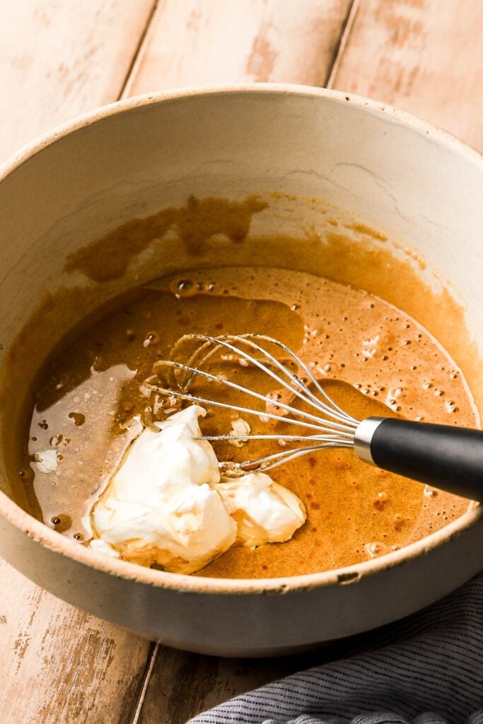 add the oil and sour cream and whisk until it's smooth