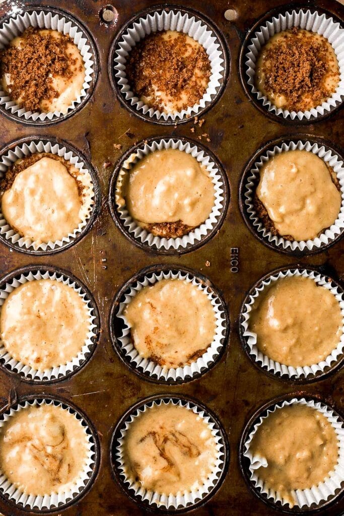 fill the muffin tins halfway with the batter, then sprinkle cinnamon sugar filling and then top with the other half of the batter, use a knife to swirl