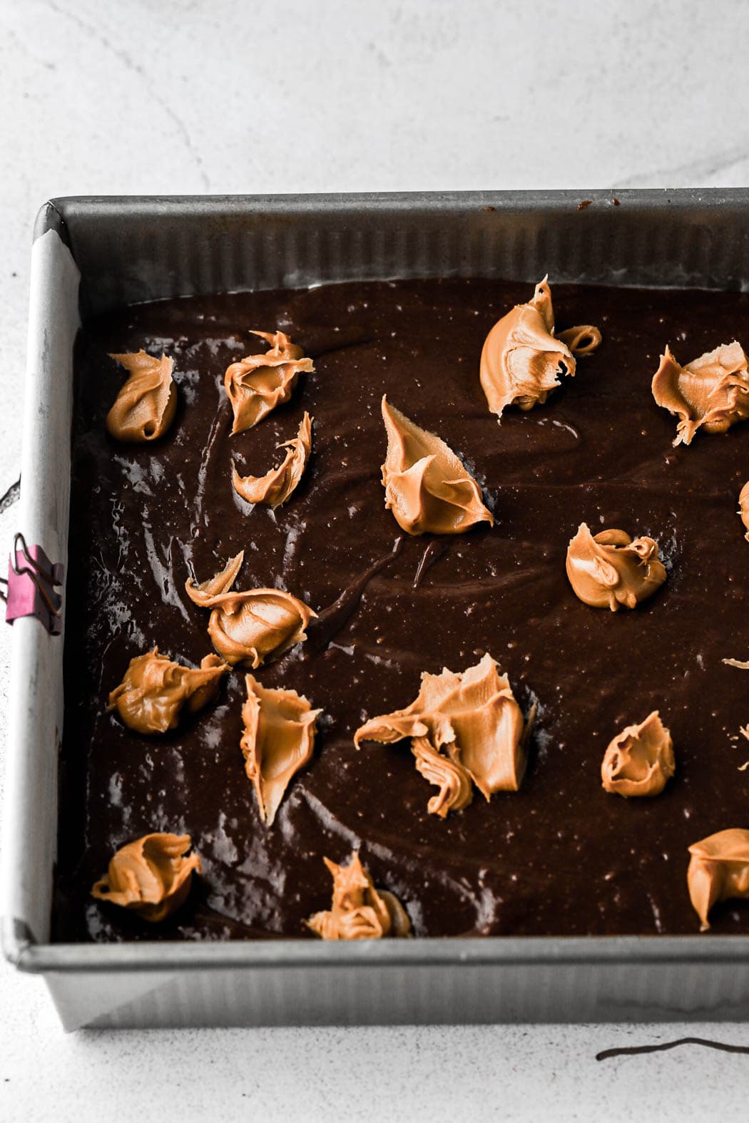 top with brownie batter and globs of cookie batter
