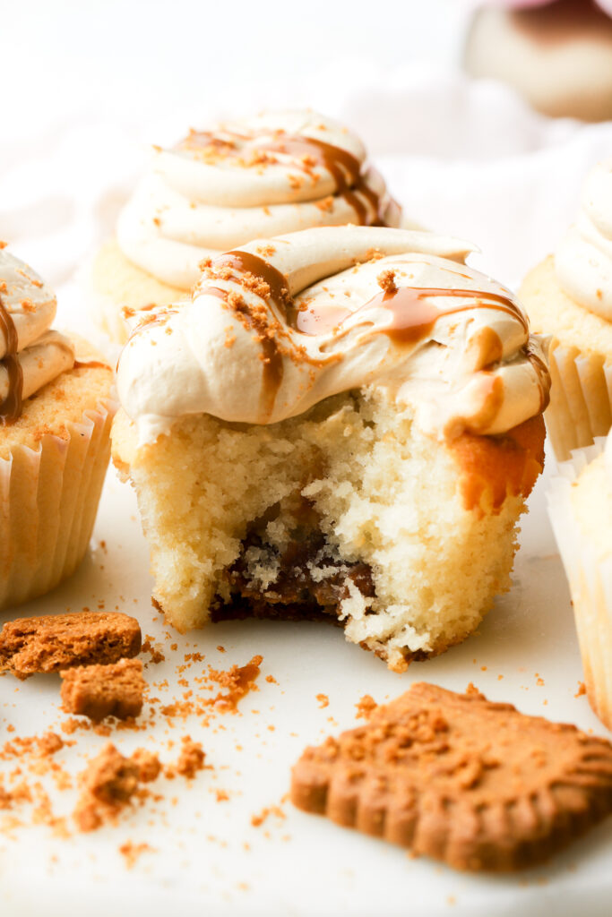 biscoff cupcake with a bite taken out, showing inside