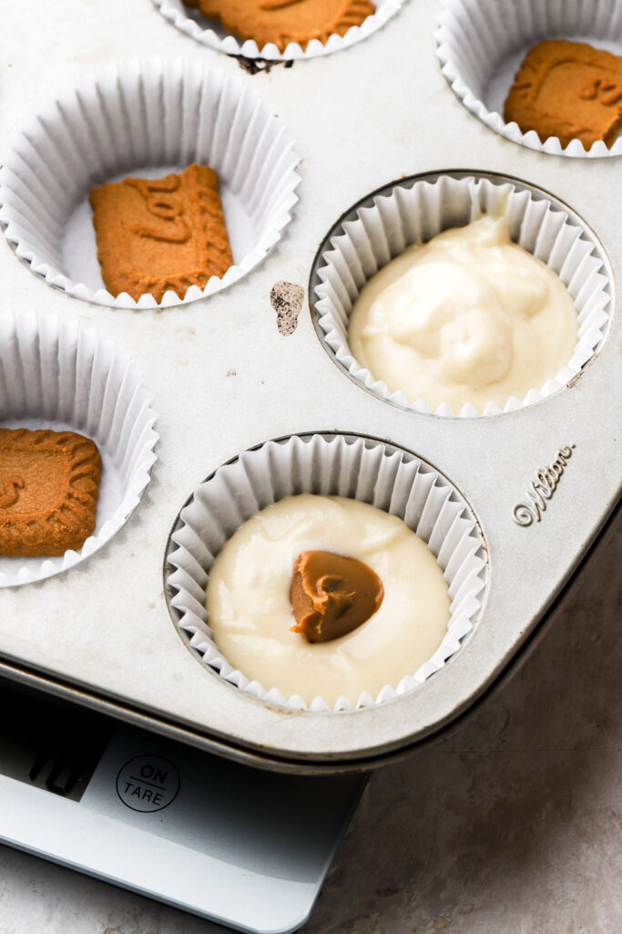 cookie butter chunk in the middle of cupcake batter