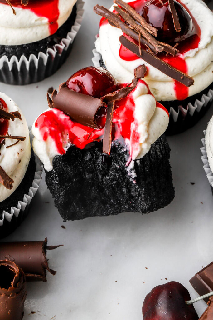 close up of black forest cupcakes with a bite taken out