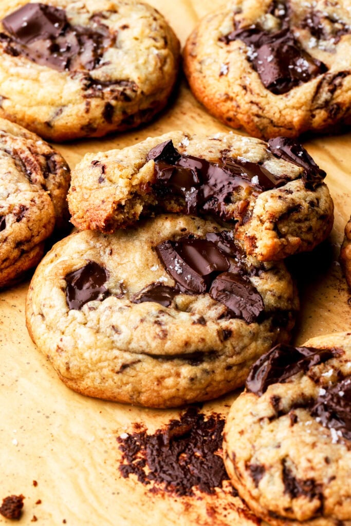 a bite taken out of a brown butter chocolate chip cookie