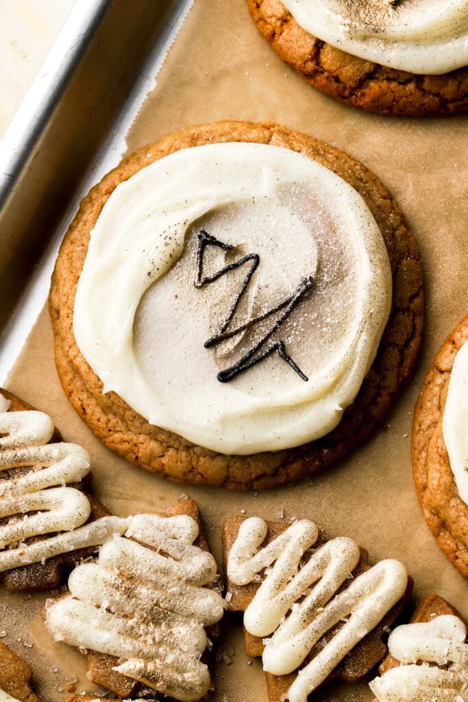 brown sugar cookies topped with frosting and christmas tree design