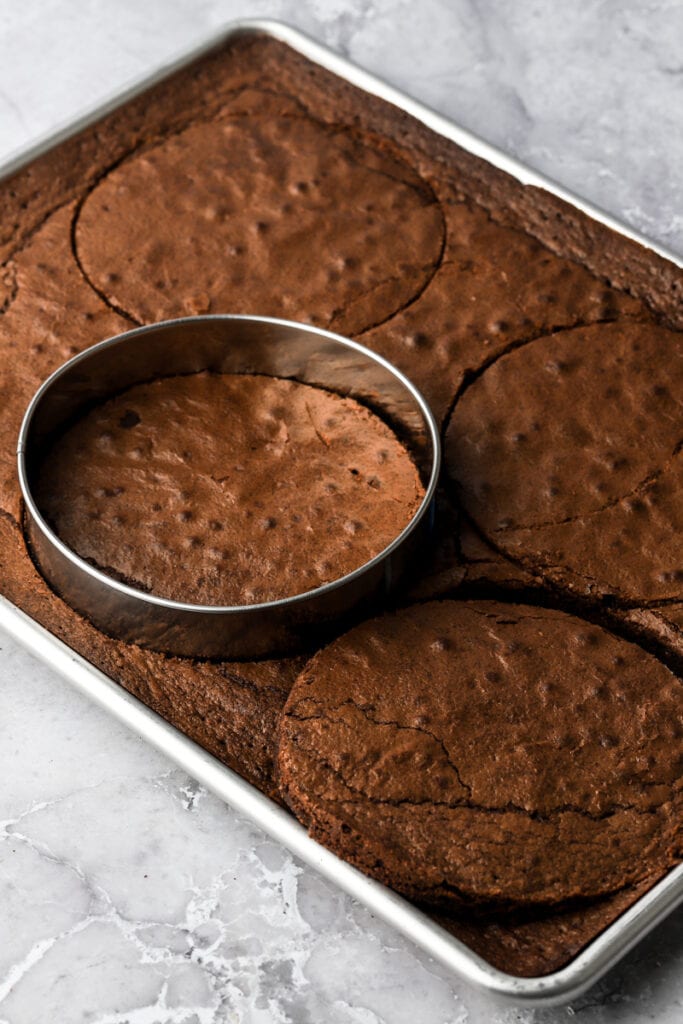 baked brownies getting cut with a 6 inch round cutter