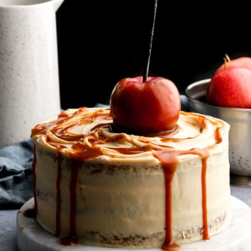 caramel apple cake topped with a caramel apple