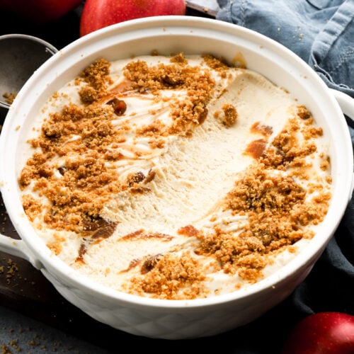 apple ice cream in a big bowl with a scoop missing from middle