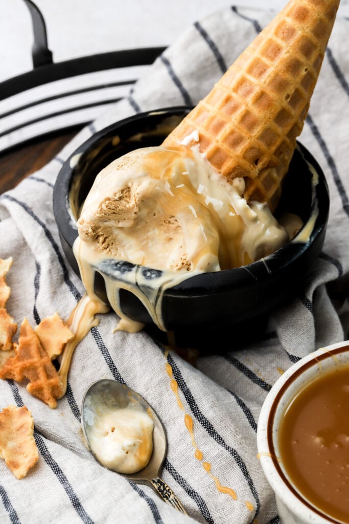 close up of ice cream in a bowl with a cone