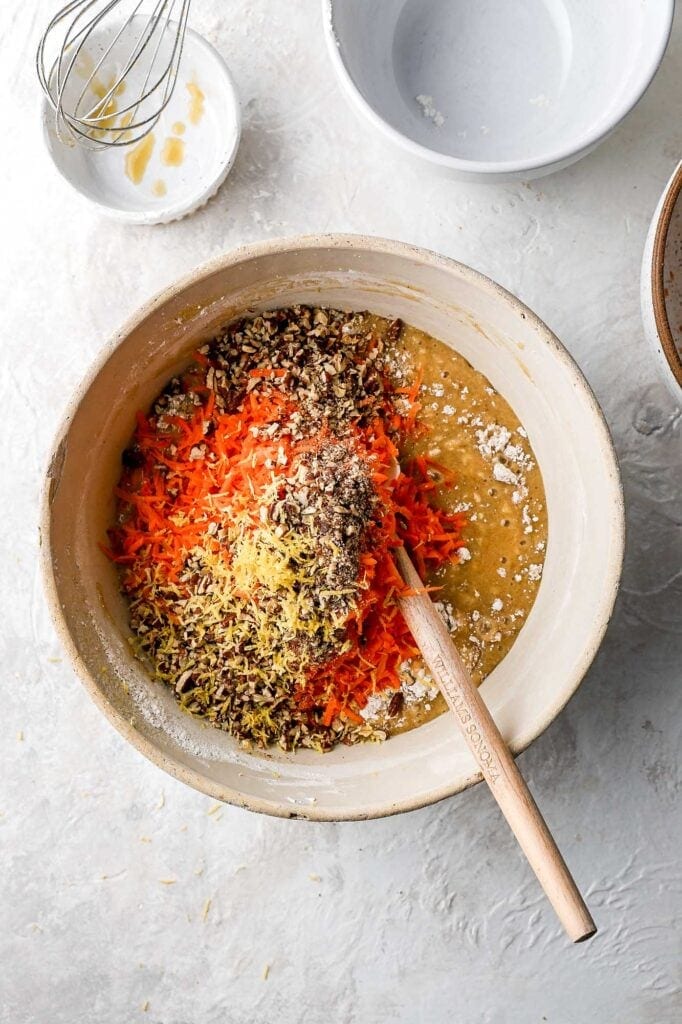 fold in carrots, nuts and lemon zest