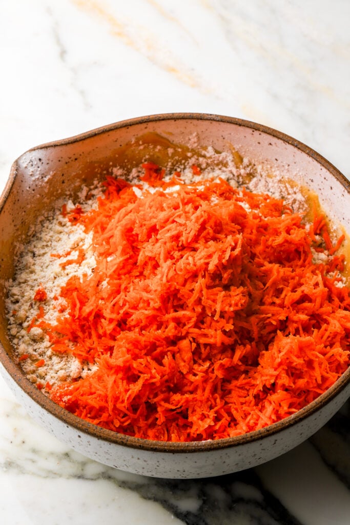 shredded carrots added to cookie dough