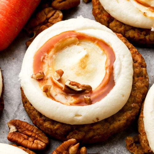 carrot cake cookies frosted with cream cheese frosting and salted caramel sauce