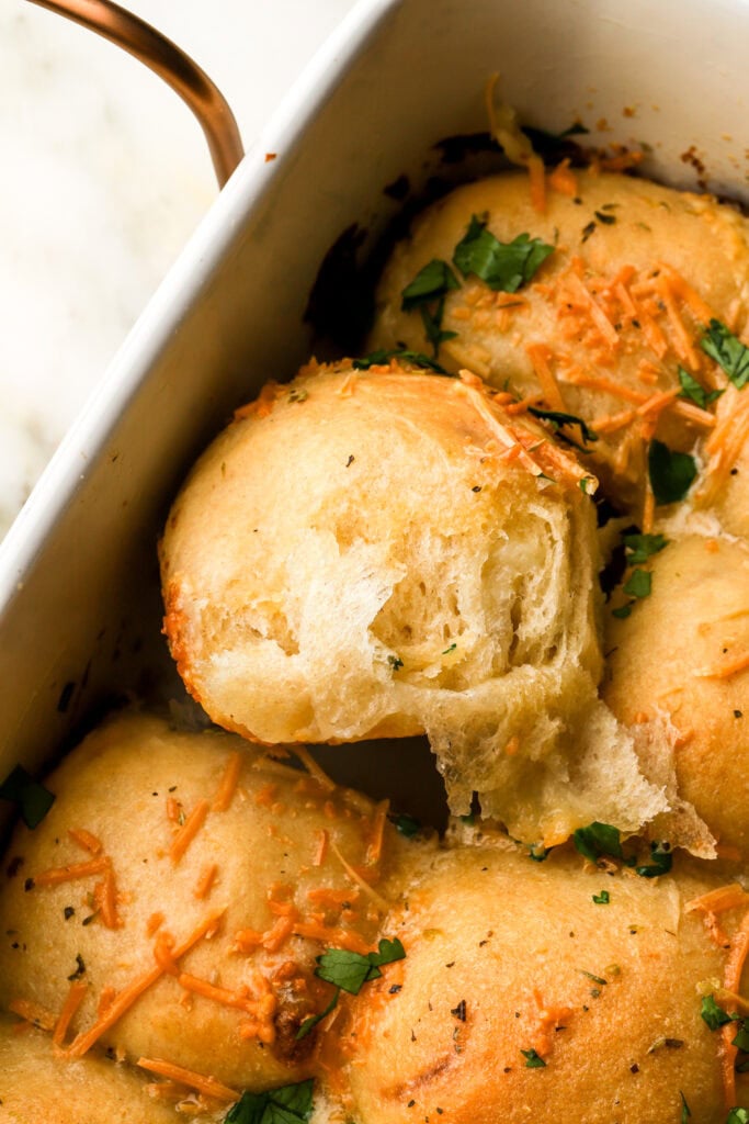slice of cheese bread roll pulled apart