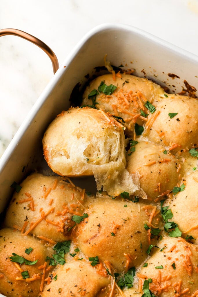 slice of cheese bread roll pulled apart