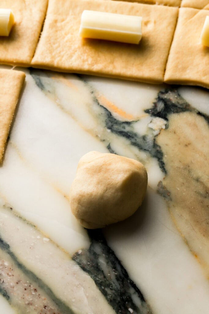 roll it around on the counter until the seams are blended