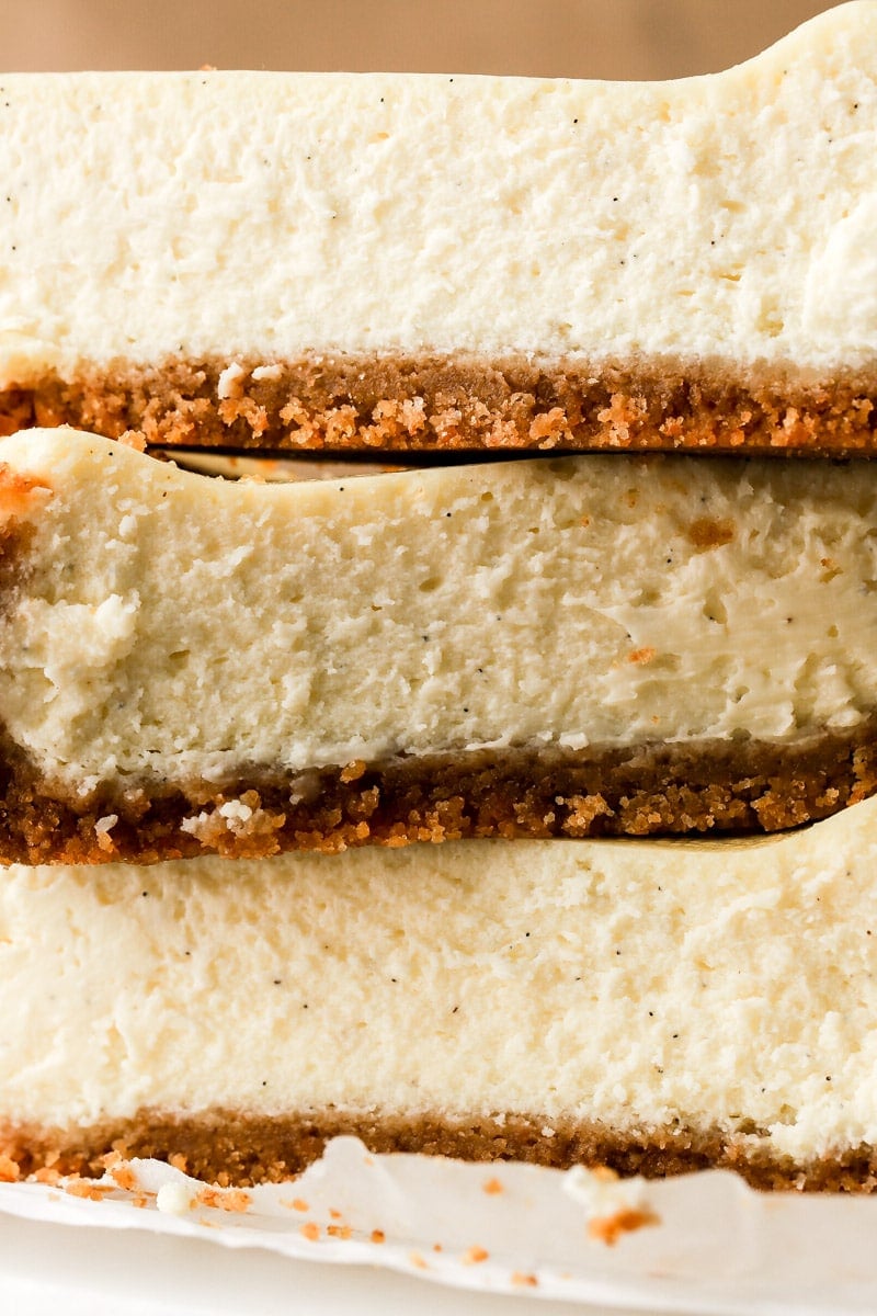 close up of three layers of cheesecake stacked