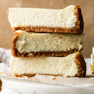 three layers of vanilla cheesecake stacked