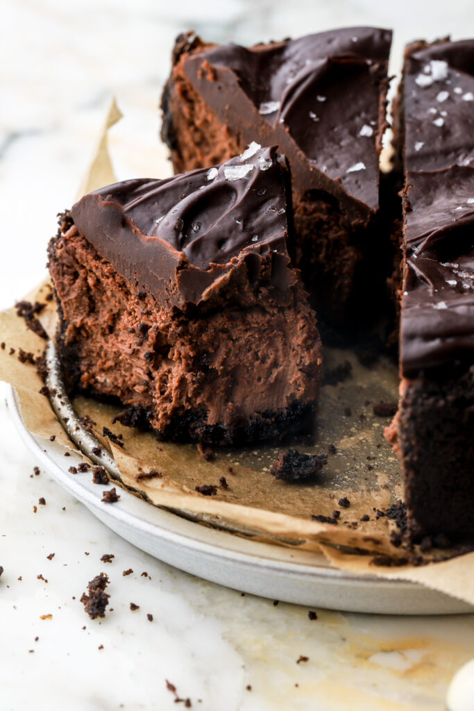 slice of chocolate cheesecake with a bite taken out