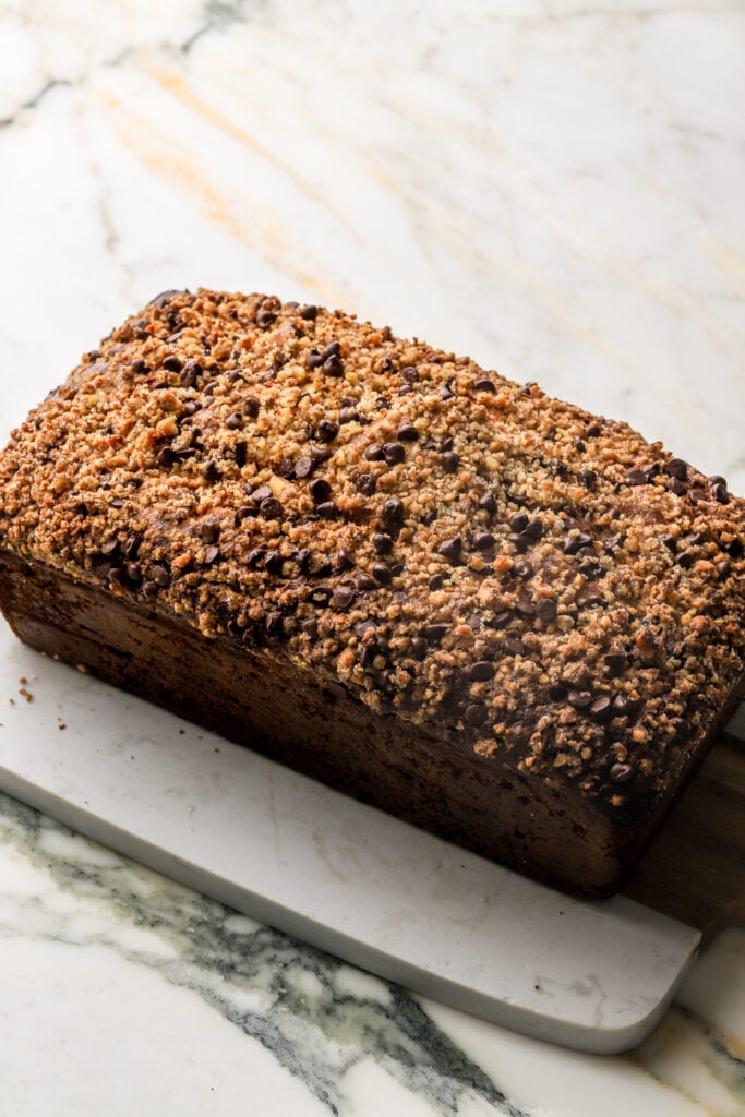 banana nut bread topped with mini chocolate chips and ground up walnut sugar