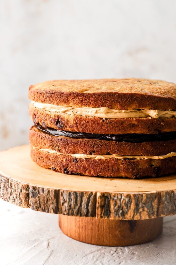 banana cake layers with peanut butter Swiss meringue buttercream and chocolate ganache