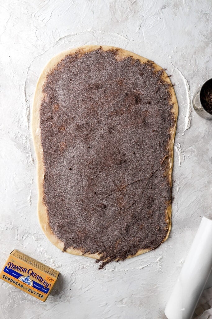 spread chocolate, cinnamon sugar mixture on top of butter