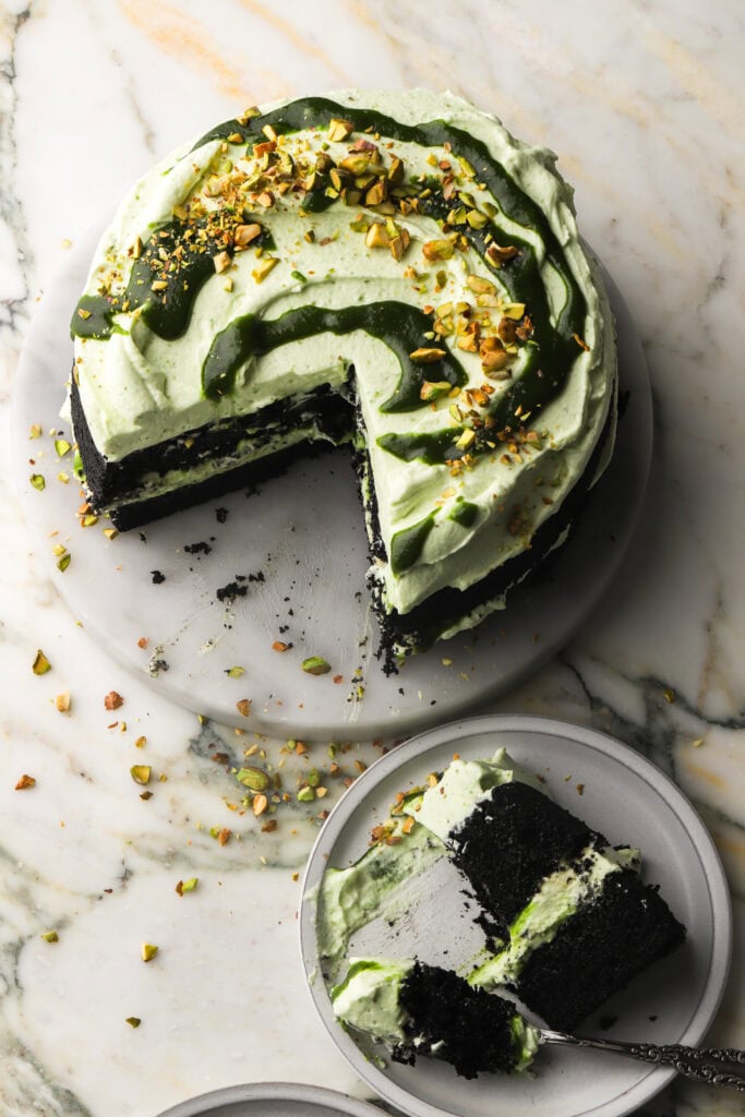 chocolate pistachio cake decorated with pistachio butter and chunks
