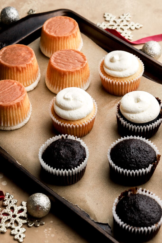 white frosting piped on cupcakes with a large round piping tip