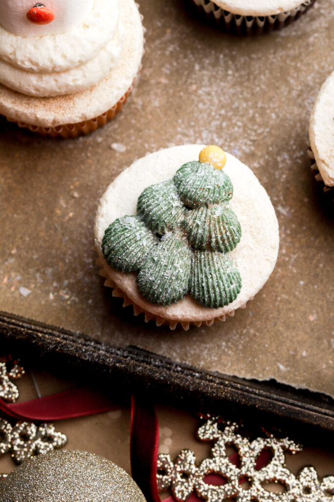 christmas tree cupcake dusted with powdered sugar to look frosted