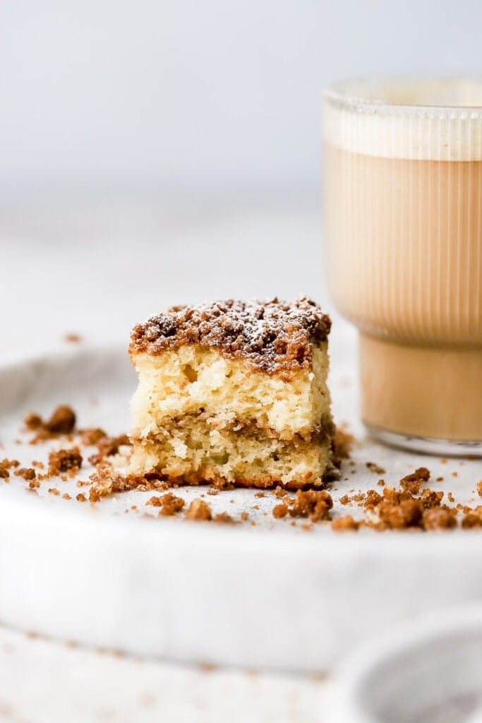 bite out of a coffee cake with coffee