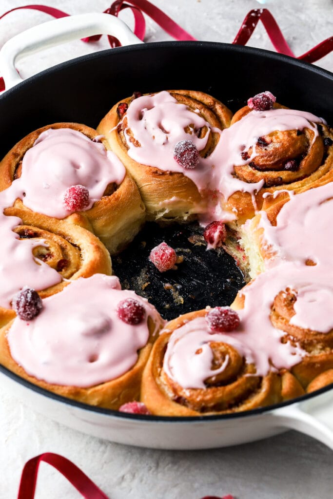cinnamon rolls in pan with middle one out