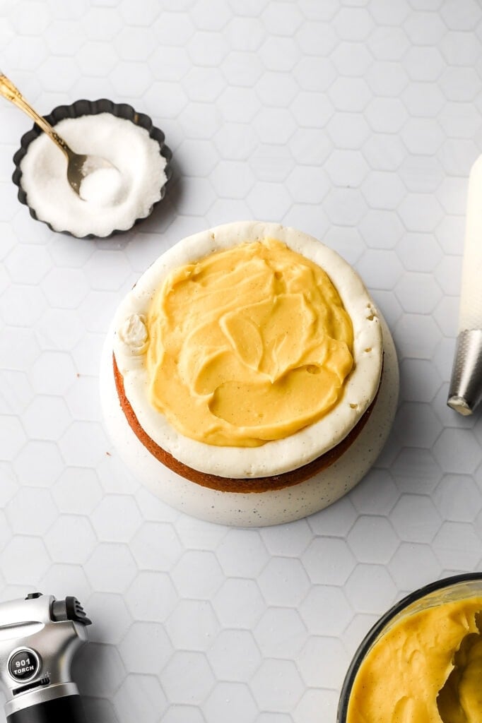 creme brulee cake layered with swiss meringue buttercream and pastry cream