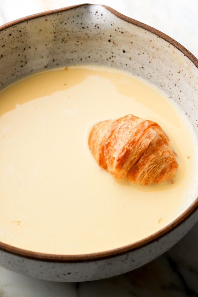 croissant dipped in egg mixture