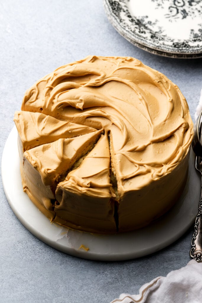 dulce de leche cake with three slices cut
