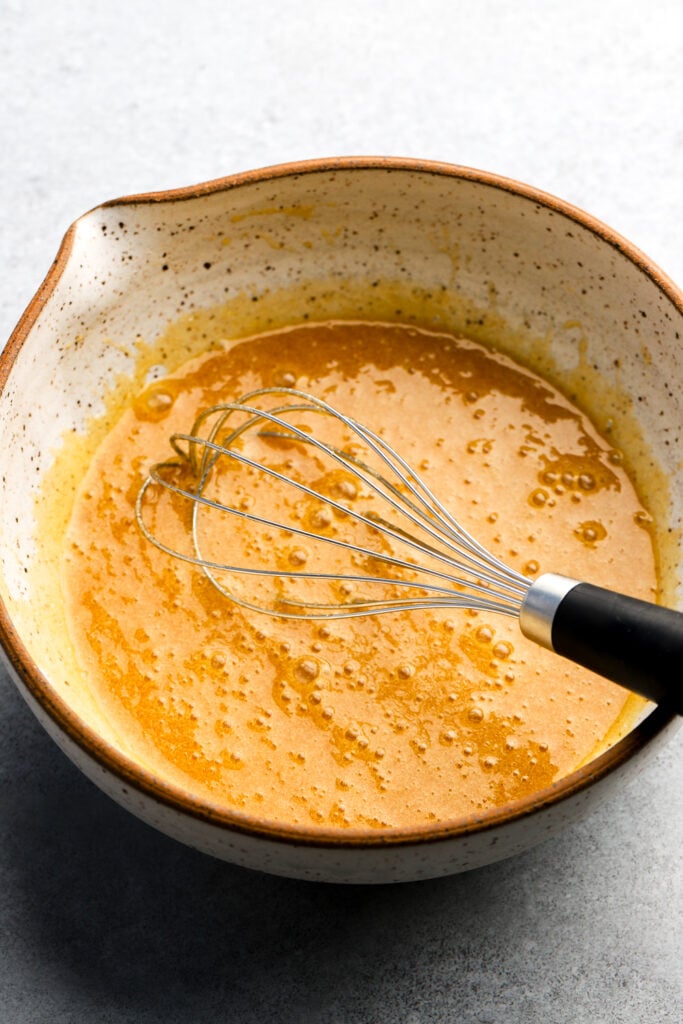 brown butter with sugar, egg whites, and vanilla whisked together